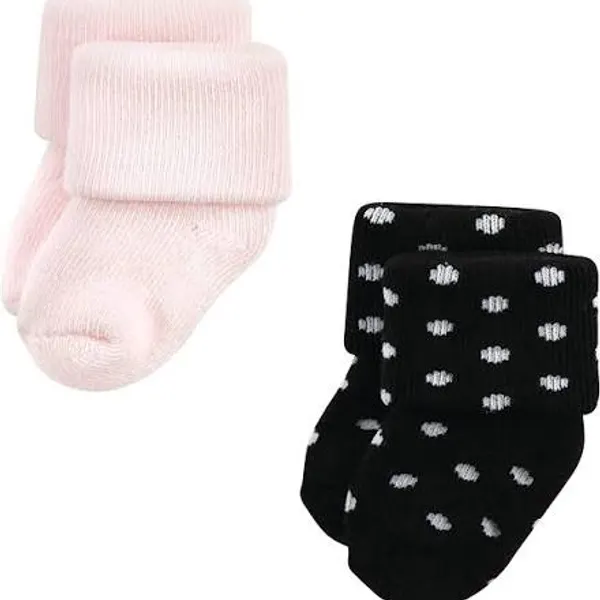 Baby socks in pale pink and in black printed with small white motifs, laid side by side