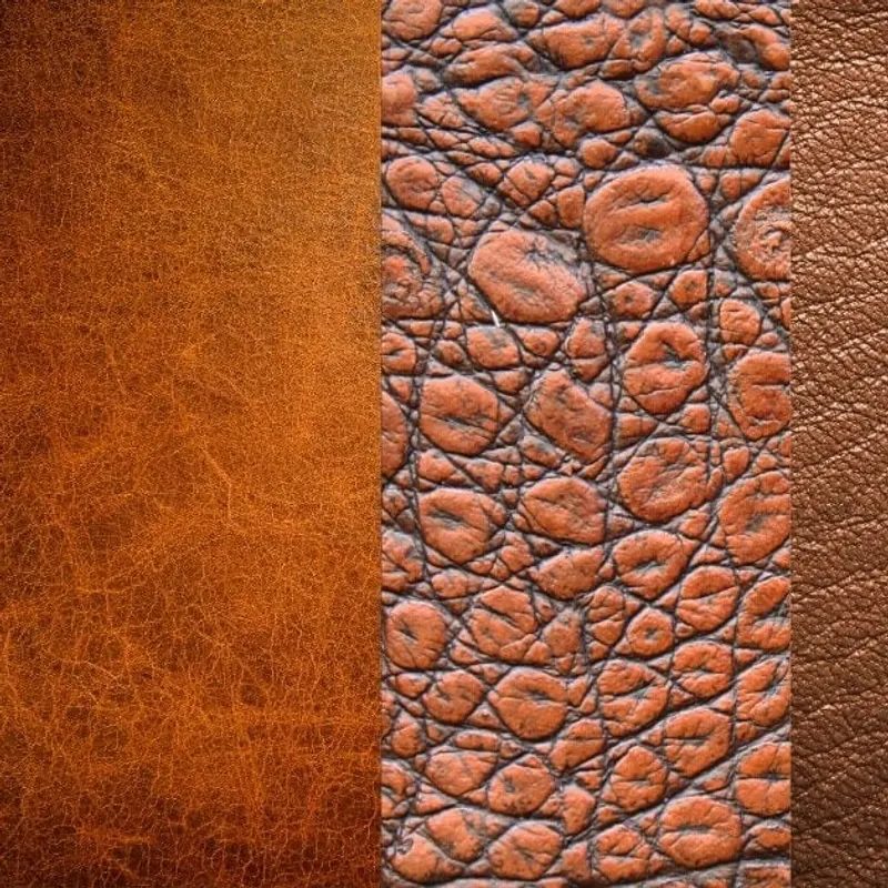 Three leather swatches in a row, a smooth tan grain beside a deeply cobbled centre panel and a fine brown grain on the right
