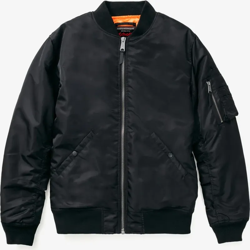 Laid flat, a black flight nylon bomber with an orange lining at the collar and a zip pocket on the sleeve
