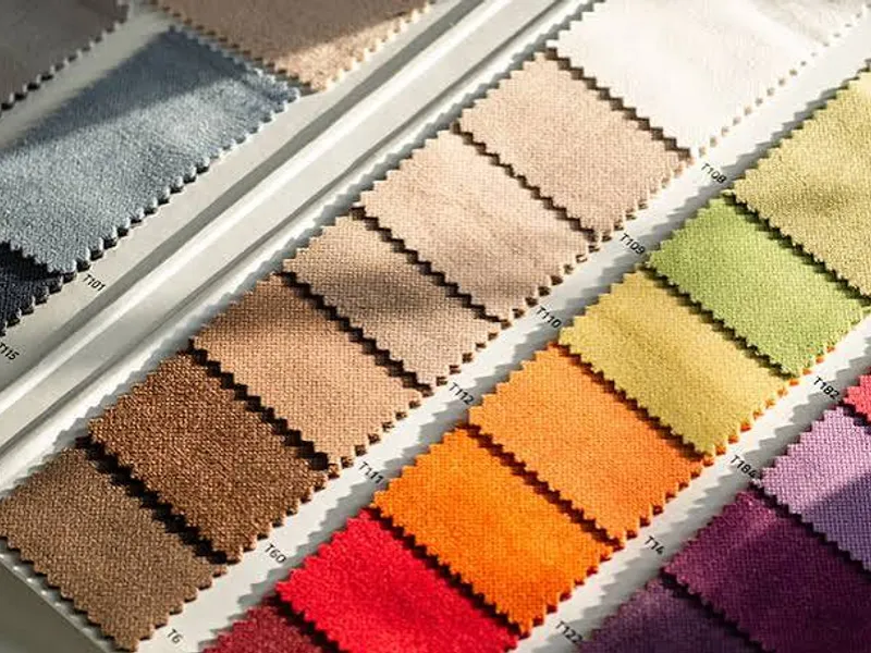 Fabric swatches on a colour card — the fabric options we quote