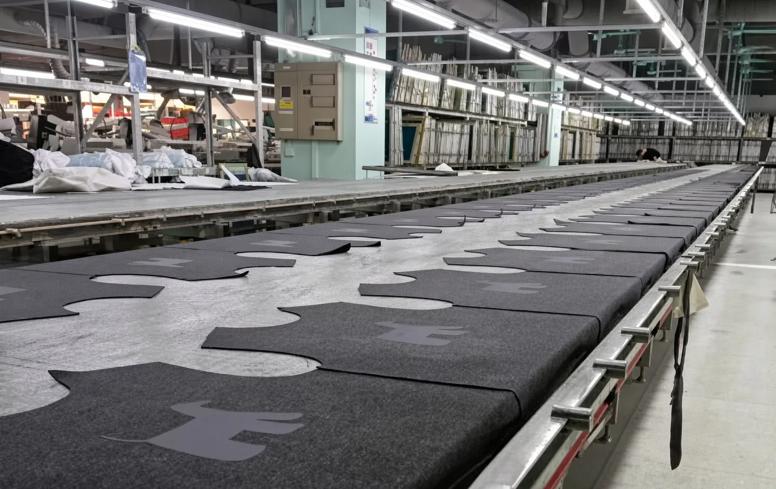 Embroidered logo beside the full-print repeat