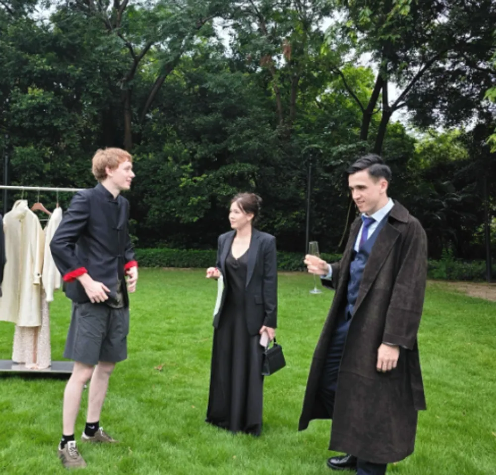 Three clients in finished pieces during an outdoor shoot