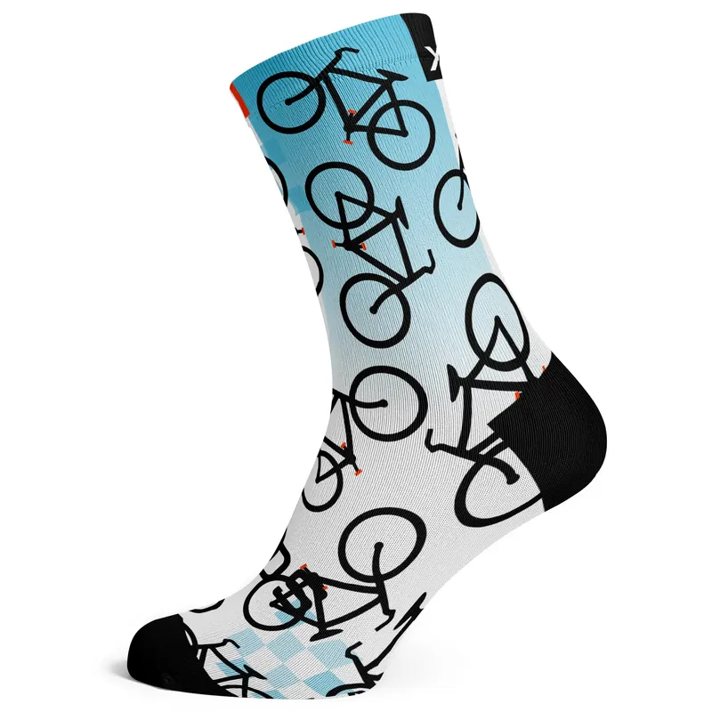 Blue crew sock in profile, a black bicycle print repeated over a pale blue-to-white gradient, with a black heel, toe and cuff tab