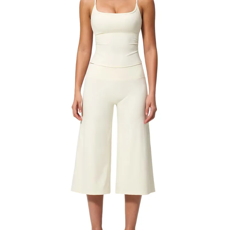 Matched cream set of a fitted cami and wide-leg cropped trousers, worn on one model