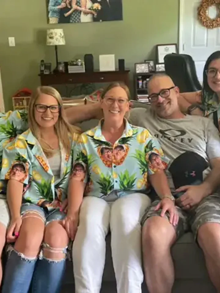 Three customers in matching mint-floral Hawaiian shirts on a group try-on