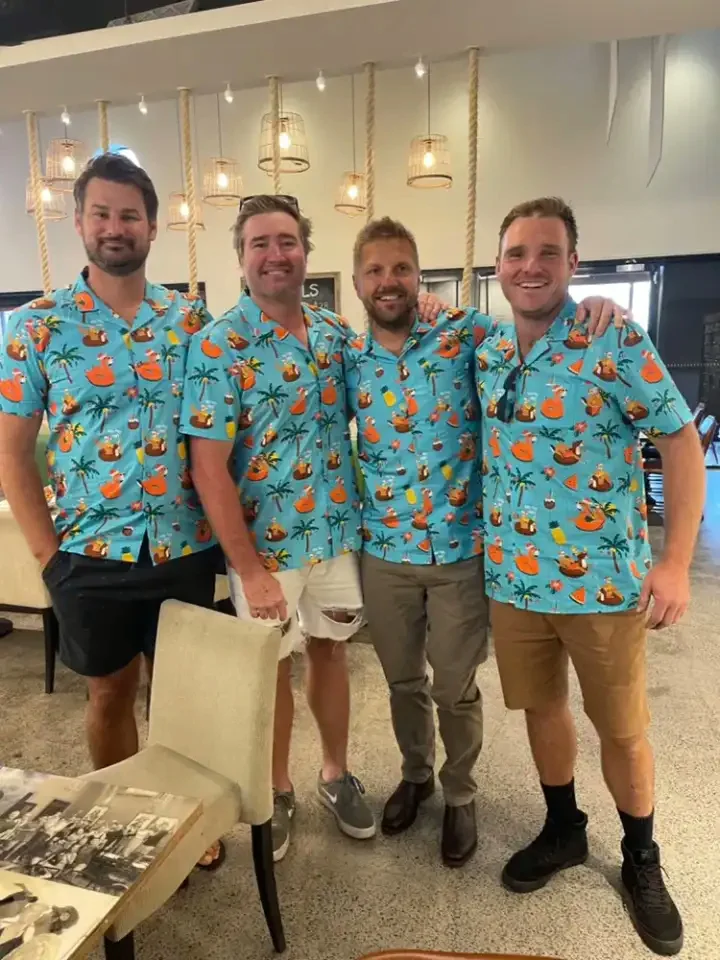 A team in matching custom Hawaiian shirts for a company shoot