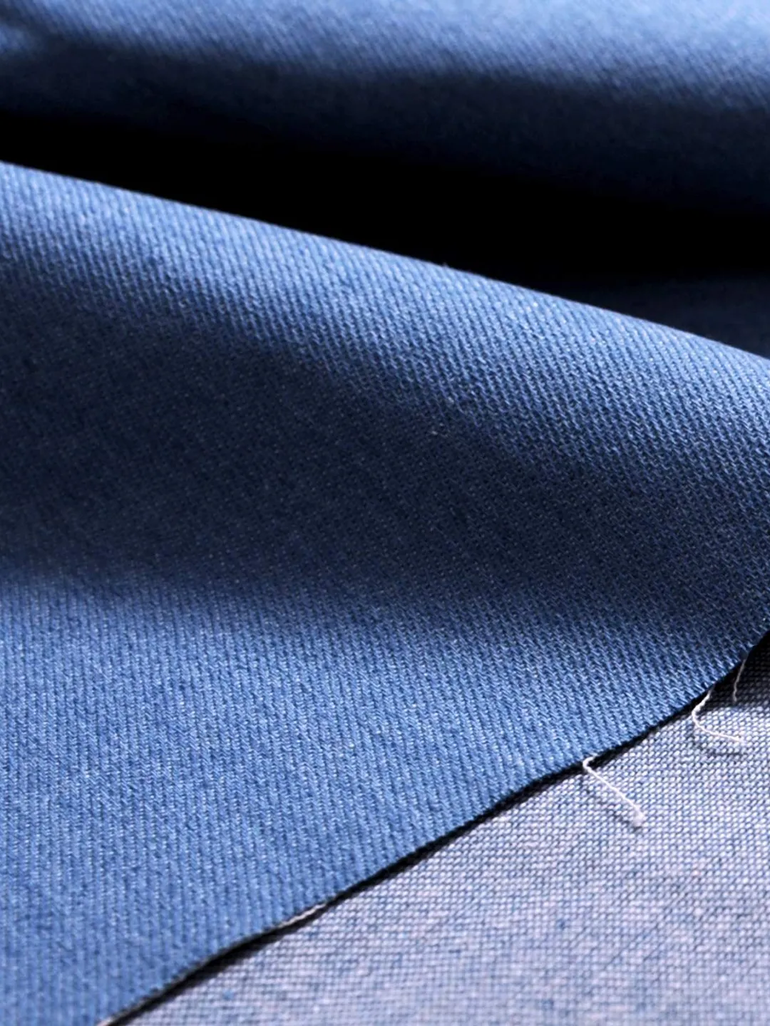 Close-up of indigo cotton denim twill with its diagonal weave