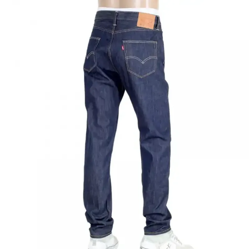 Dark indigo tapered-leg jeans, back view