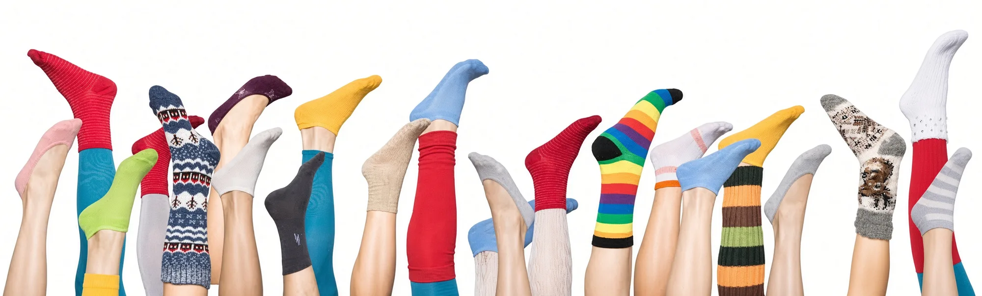 Legs raised in a line against white, each wearing a different sock — red, teal, lime, mustard and a full rainbow stripe