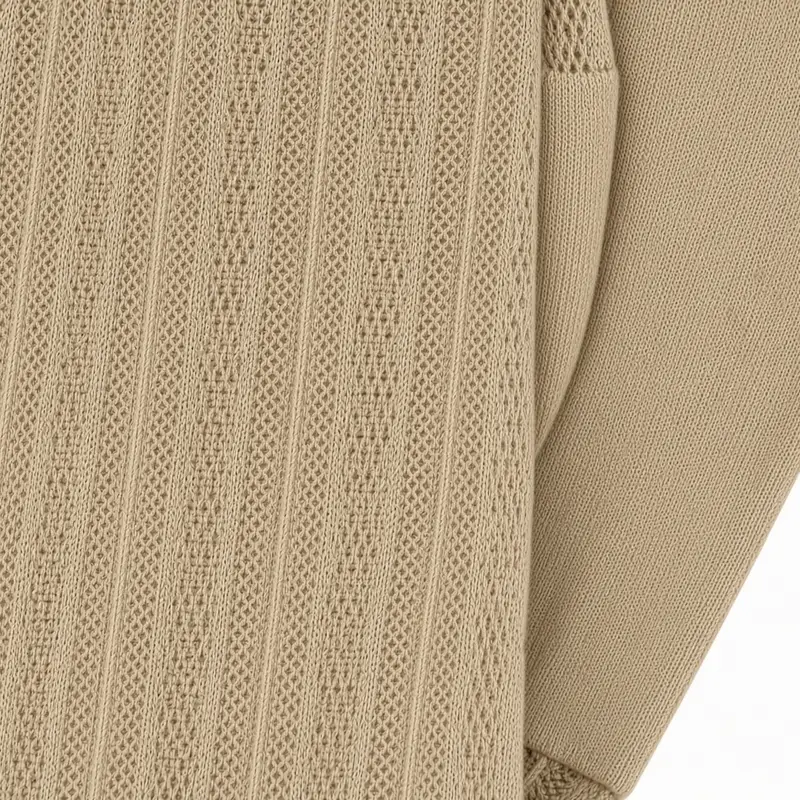 Taupe knit in a fine gauge, a ribbed panel running against a plain ground