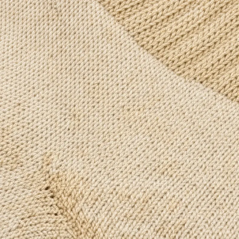 Oatmeal knit in two panels, one plain and one waffle-textured