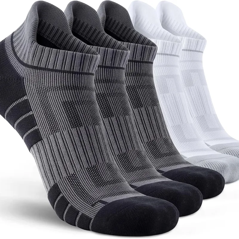 Low-cut athletic socks in grey and white lined up in a row
