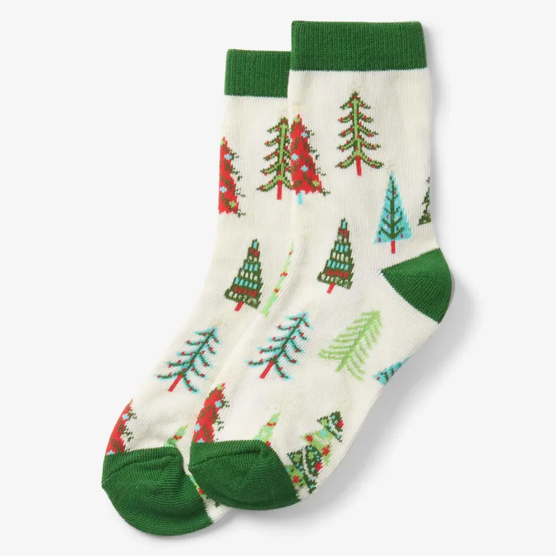 Kids socks in cream with a green cuff, knitted with a winter-tree pattern