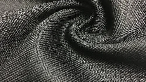 Close-up of a grey-green moisture-wicking performance knit