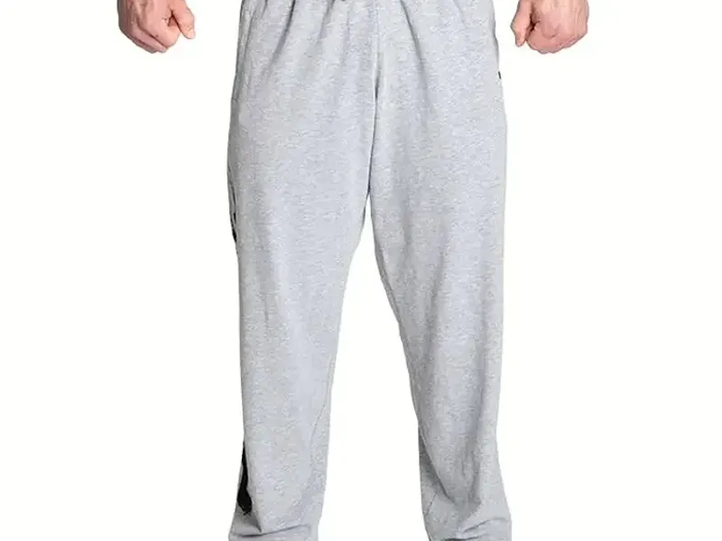 Grey joggers with a drawcord waistband displayed on a mannequin