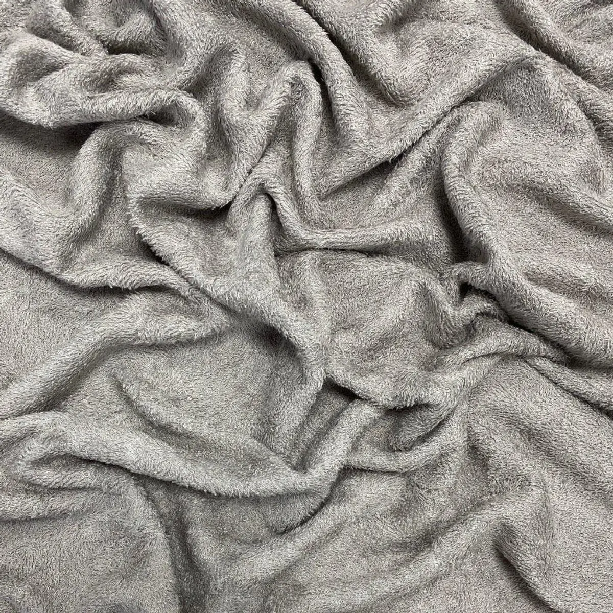 Silver-grey brushed cloth photographed draped in soft folds